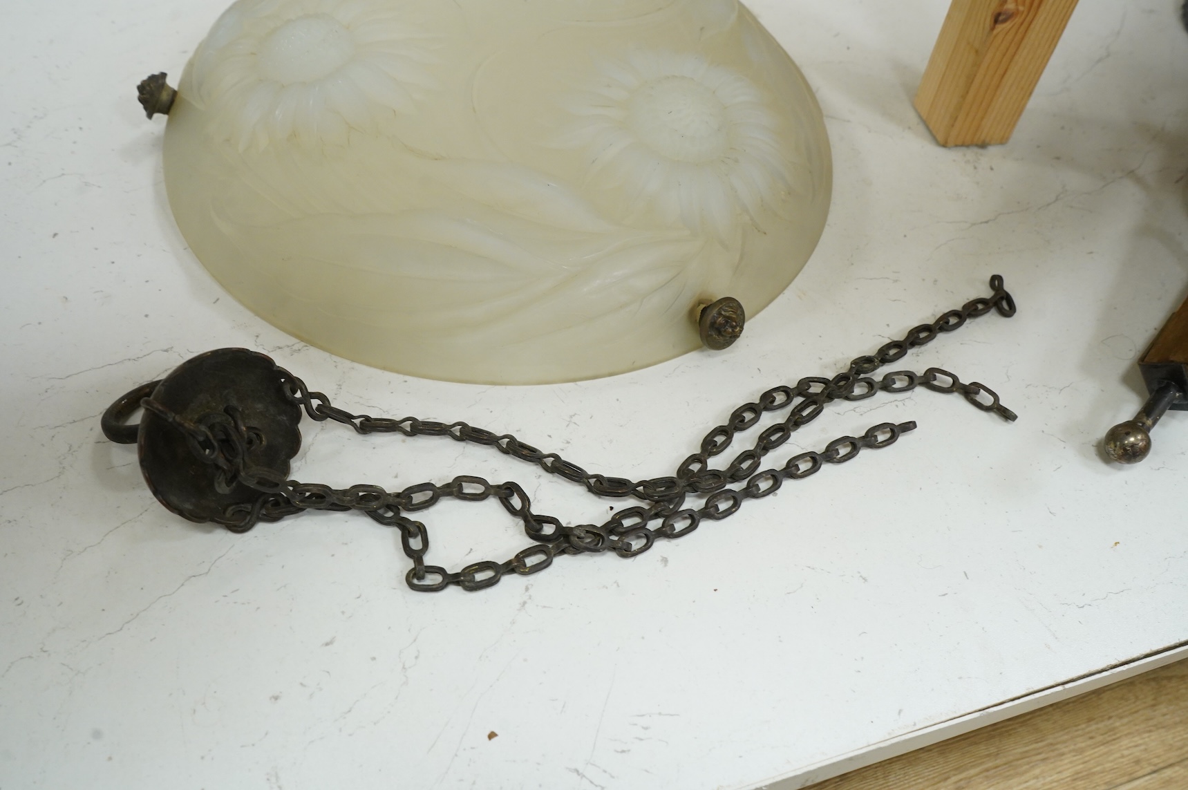 A Lalique style opalescent glass ceiling shade decorated with three sunflowers, 34cm in diameter
